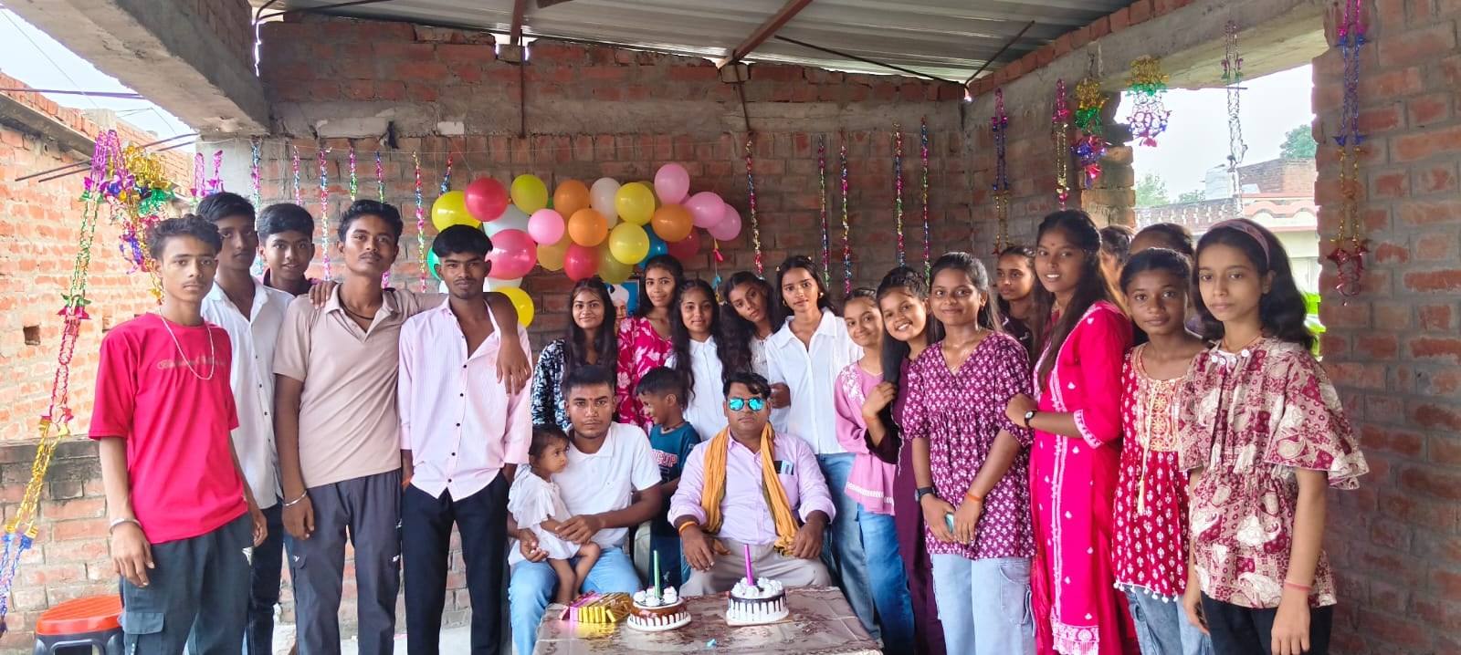 Students of Fultun Sir’s Coaching Centre with their teachers at a celebration